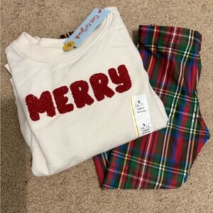 Cat and Jack Merry written in red sweatshirt and stretchy red plaid pants.
